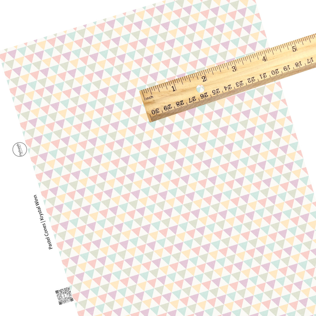 Light green, light blue, light yellow, pink, and purple cones on a distressed faux leather sheets