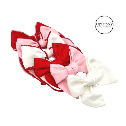 Solid color shaker bows with colored stitching