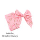Pink christmas bow decorated with prancing reindeer