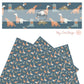 Orange dino with orange heart sweater and orange flower, blue dino with be mine heart, and green dino with blue, white, and orange heart balloons on dark blue faux leather sheet