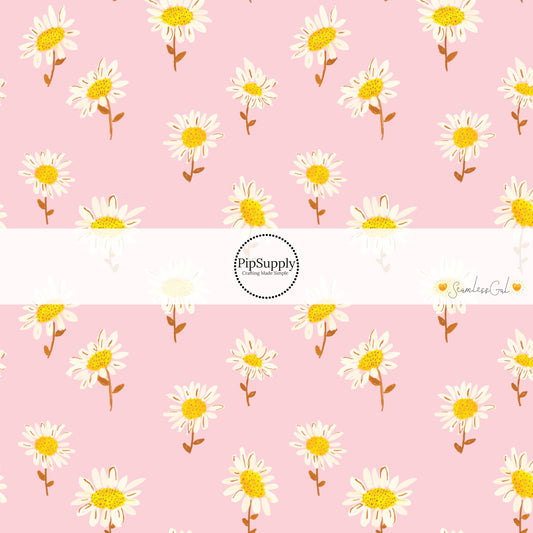 Scattered painted white daisies on light pink fabric by the yard