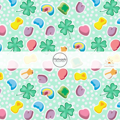 Green clovers, pink hearts, rainbows, and shooting star marshmallow charms on a polka dot green bow strip