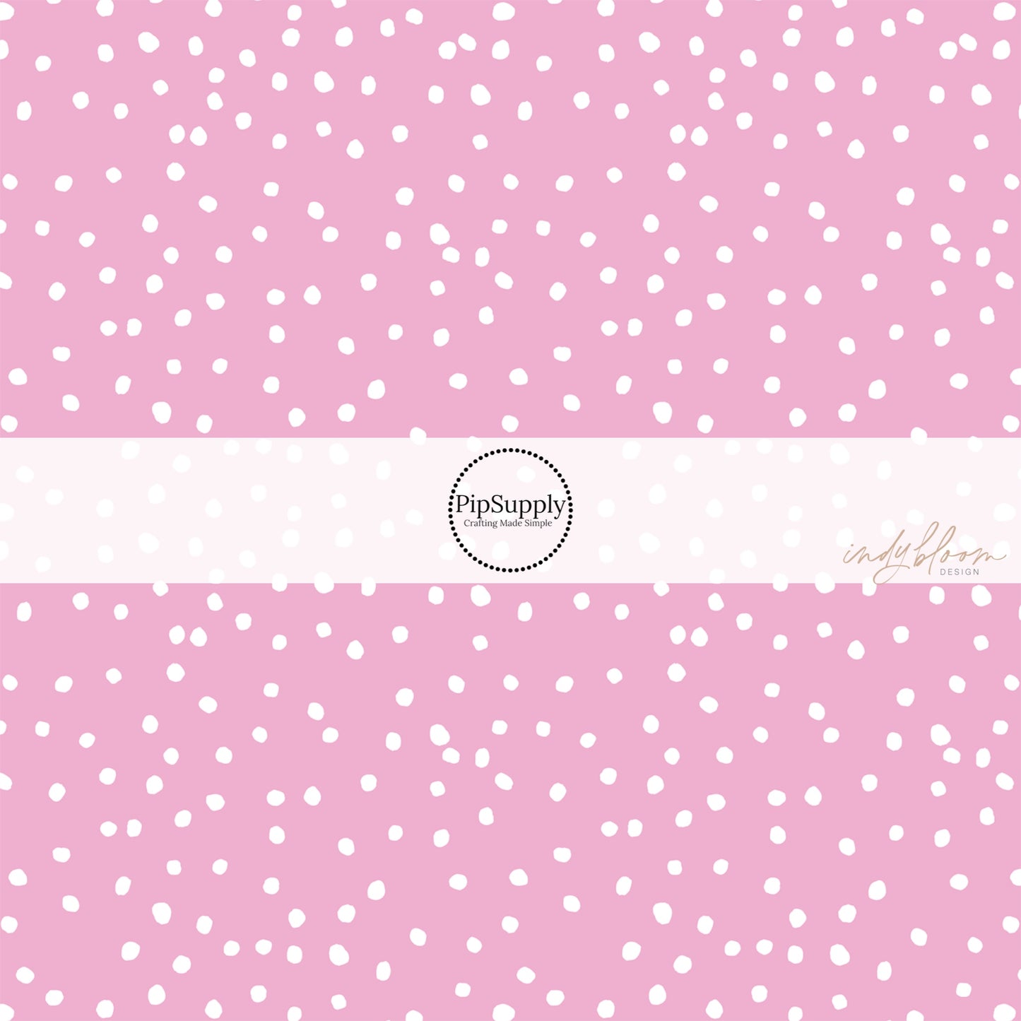 Pink fabric by the yard with scattered small white polka dots.