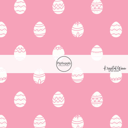 White eggs with polka dots and fun lines on a pink bow strip