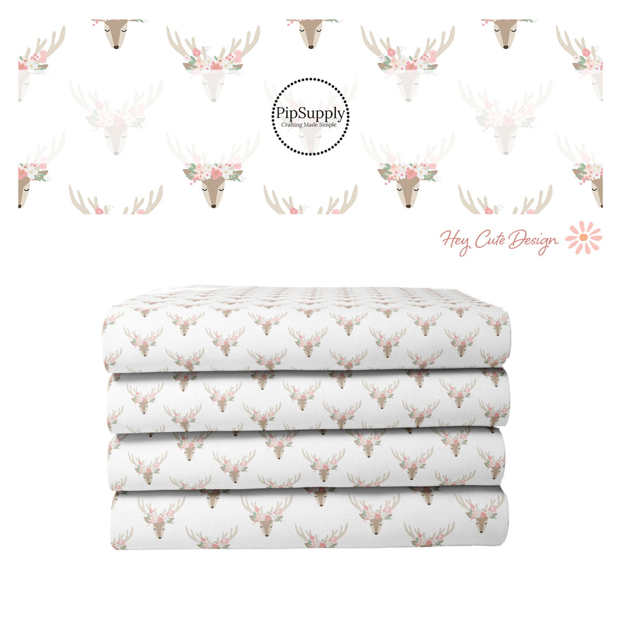 White fabric stack with floral reindeer 