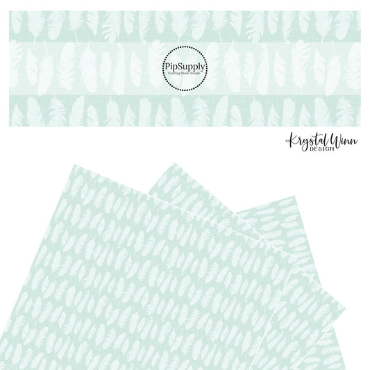 White feathers on a distressed aqua faux leather sheets
