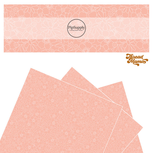 Sheet covered in flowers outlined in white on a pink faux leather sheet