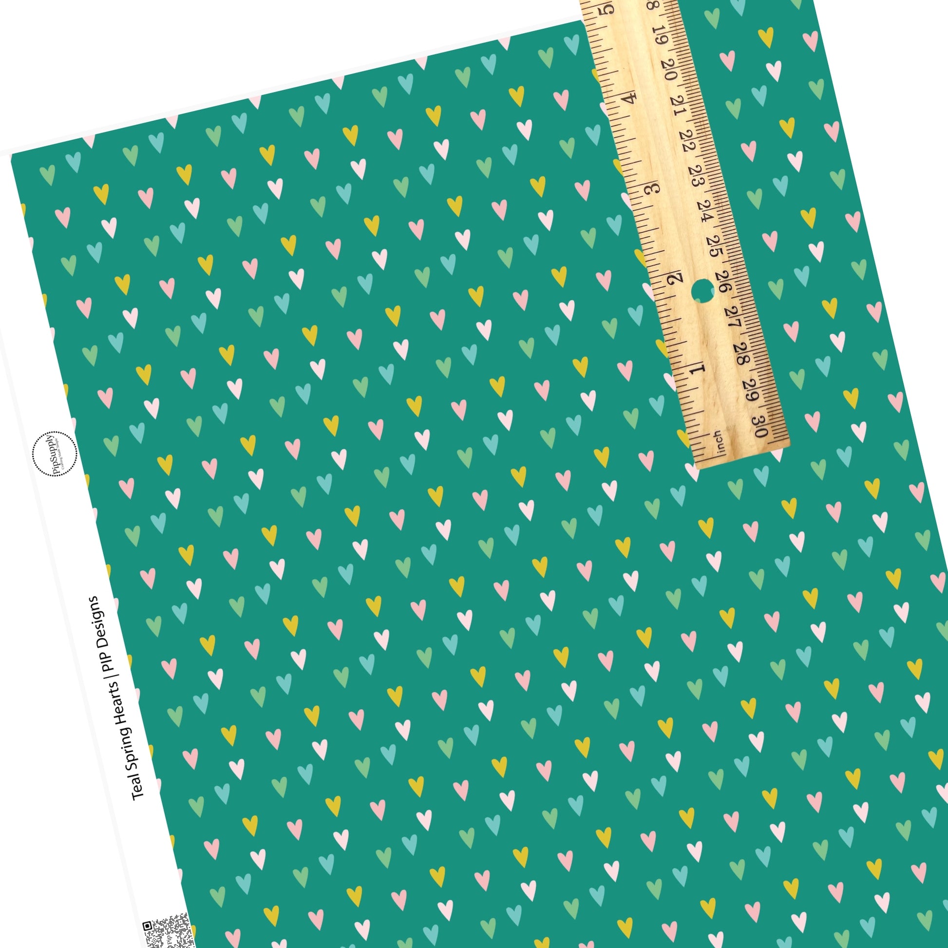 Green, blue, yellow, and pink tiny scattered hearts on teal faux leather sheets