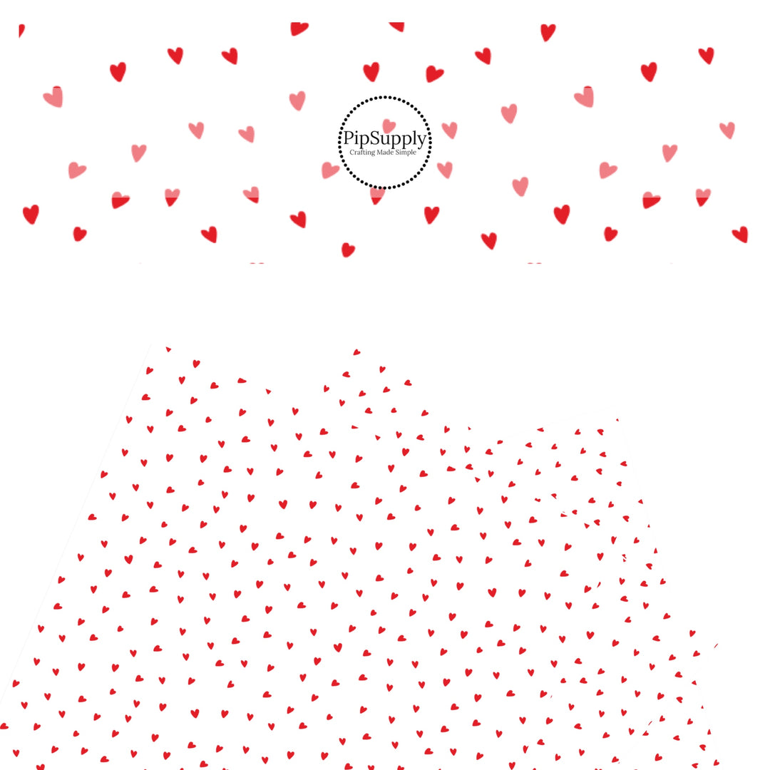 Scattered red hearts on a white faux leather sheet