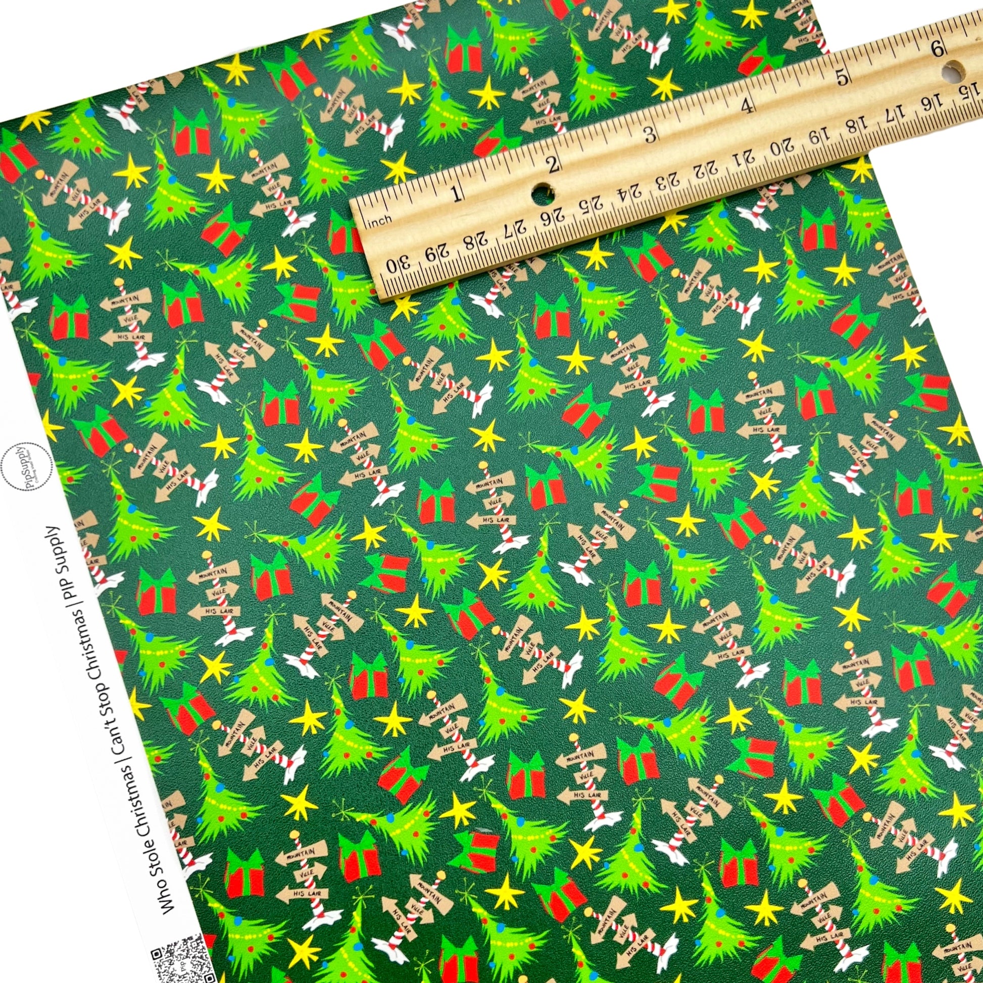 Green faux leather sheet with red presents and green christmas trees