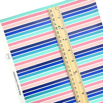 Wide lined pink, navy, and turquoise pattern faux leather sheet.