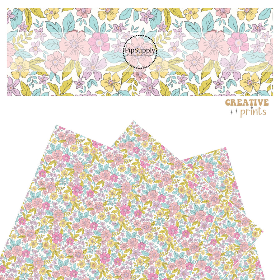 Pink, lavender, yellow, and blue flowers with blue and green leaves on white faux leather sheets