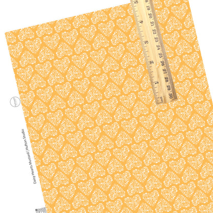 Floral hearts on yellow faux leather sheet