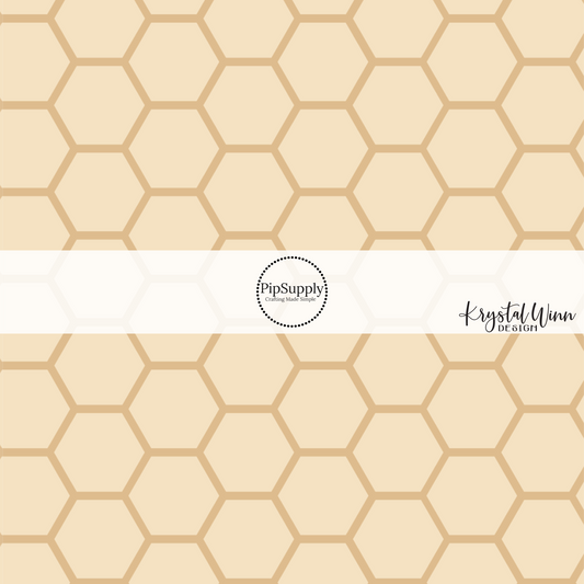 Light tan fabric by the yard with a golden honeycomb outline