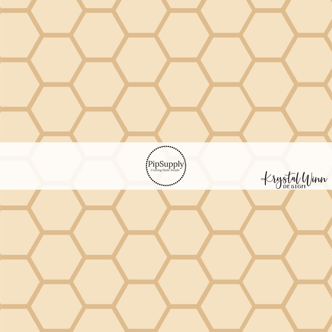 Light tan fabric by the yard with a golden honeycomb outline