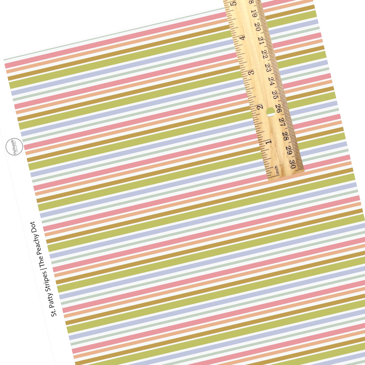 Thick and thin green, blue, and pink stripes on a white faux leather sheet