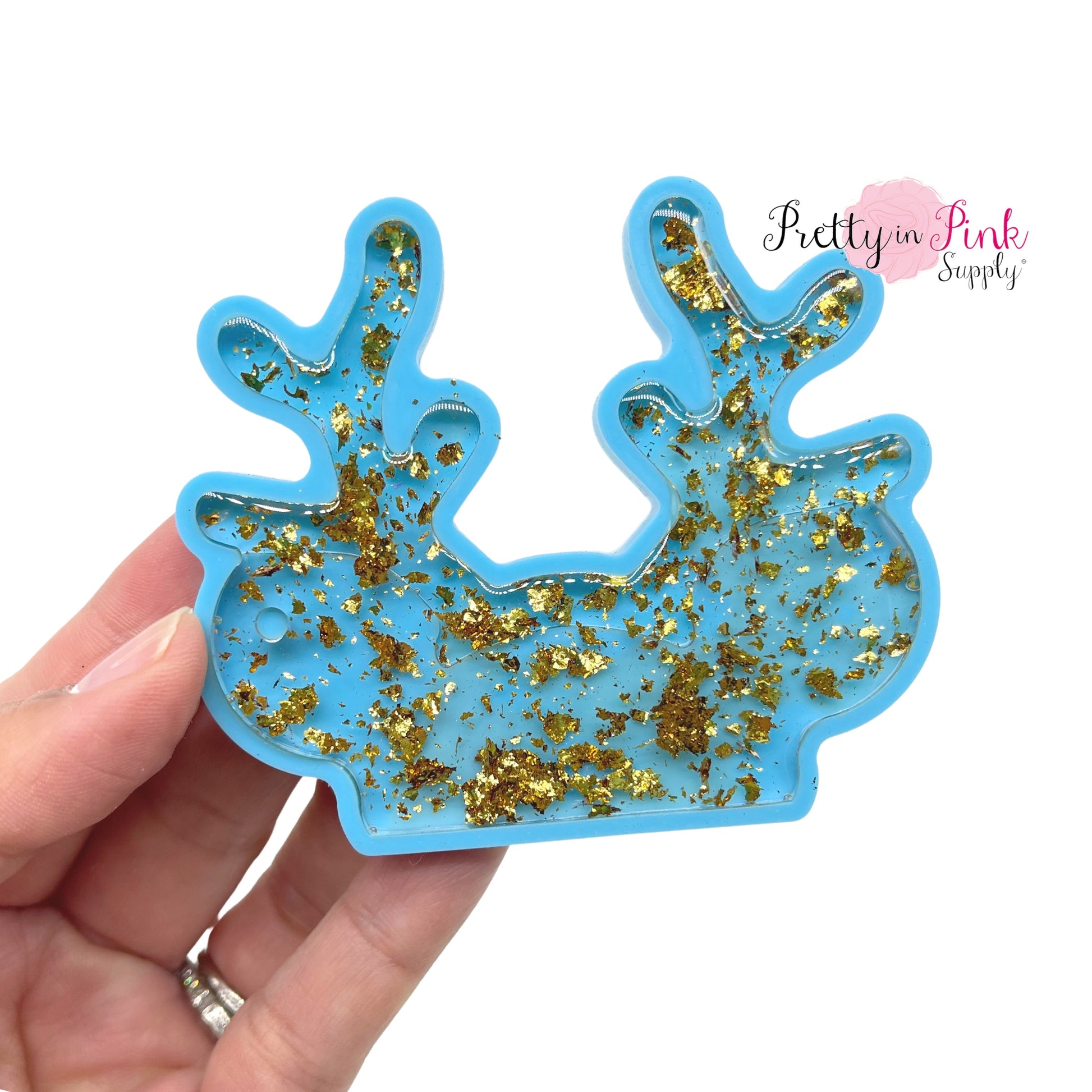 Blue Silicone antler mouse ear keychain shown filled with glitter resin.