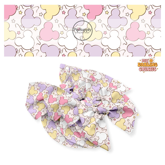 Pink, purple, white, and yellow pastel mouse head balloons with stars on cream bow strips