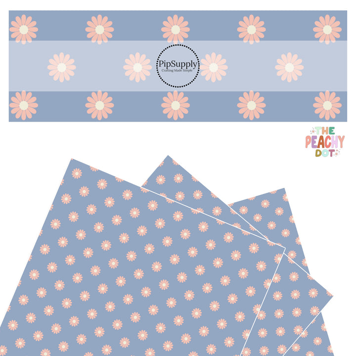 peach flowers with cream center on powder blue faux leather sheets