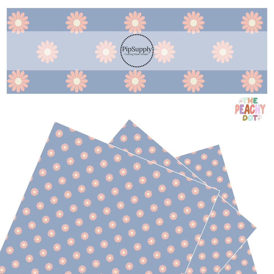 peach flowers with cream center on powder blue faux leather sheets