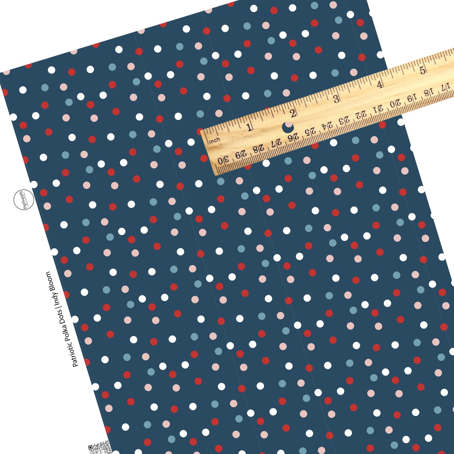 Pink, blue, white, and red polka dots on navy faux leather sheets