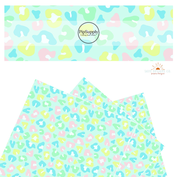 Bright blue, green, yellow, and pink leopard spots on mint faux leather sheets