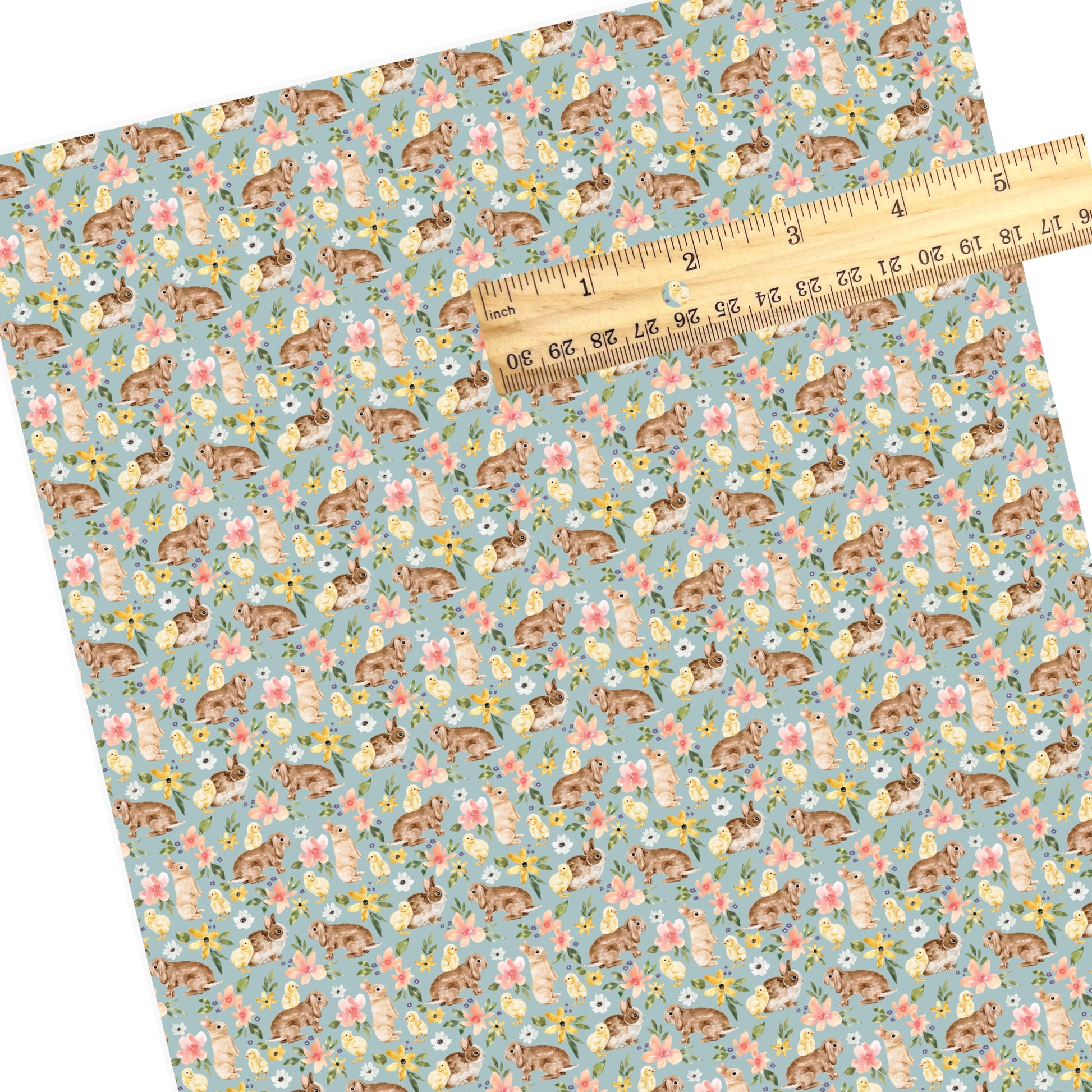 Yellow, white, and pink flowers with brown bunnies and yellow chicks on blue faux leather sheets