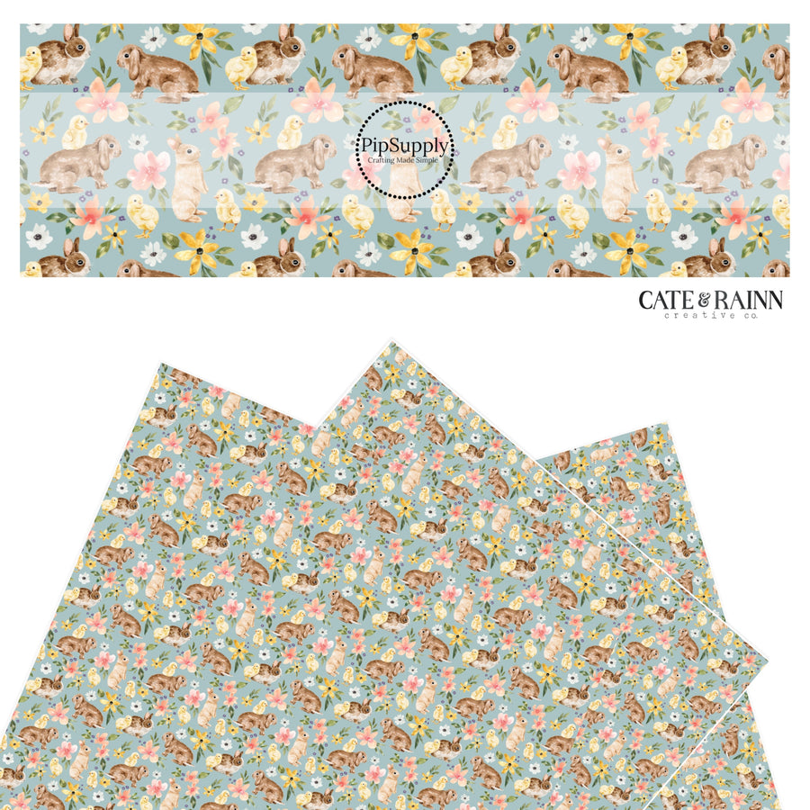 Brown bunnies with yellow chicks with pink, yellow, and white flowers on blue faux leather sheet