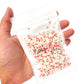 Bag of Christmas mini Santa face polymer clay slices.