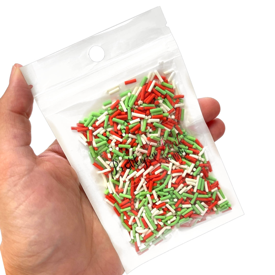 Bag of Christmas red, green, and white sprinkle polymer clay slices.
