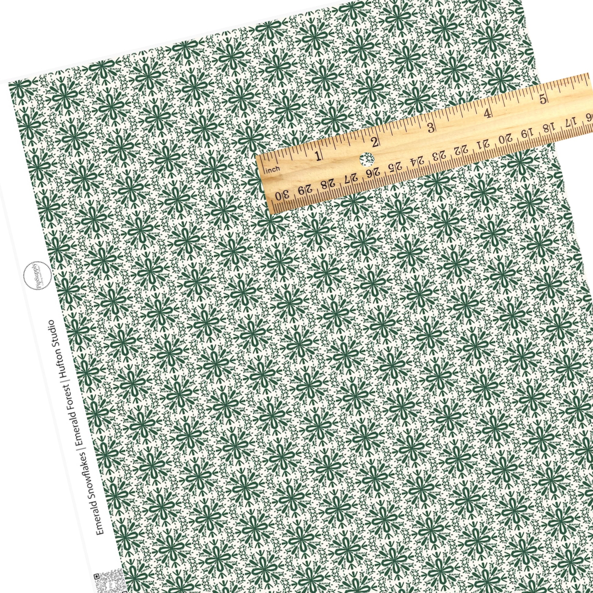 winter green snowflakes faux leather sheet on cream background