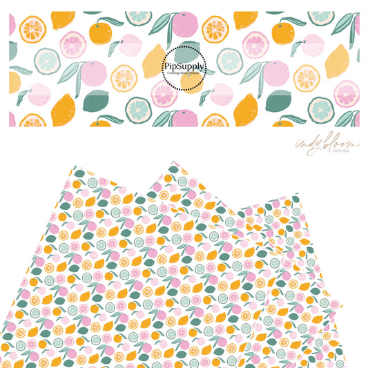 Slices and whole citrus fruit on white faux leather sheets