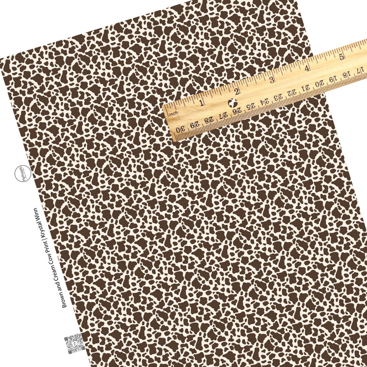 scattered brown cow print on cream faux leather sheets