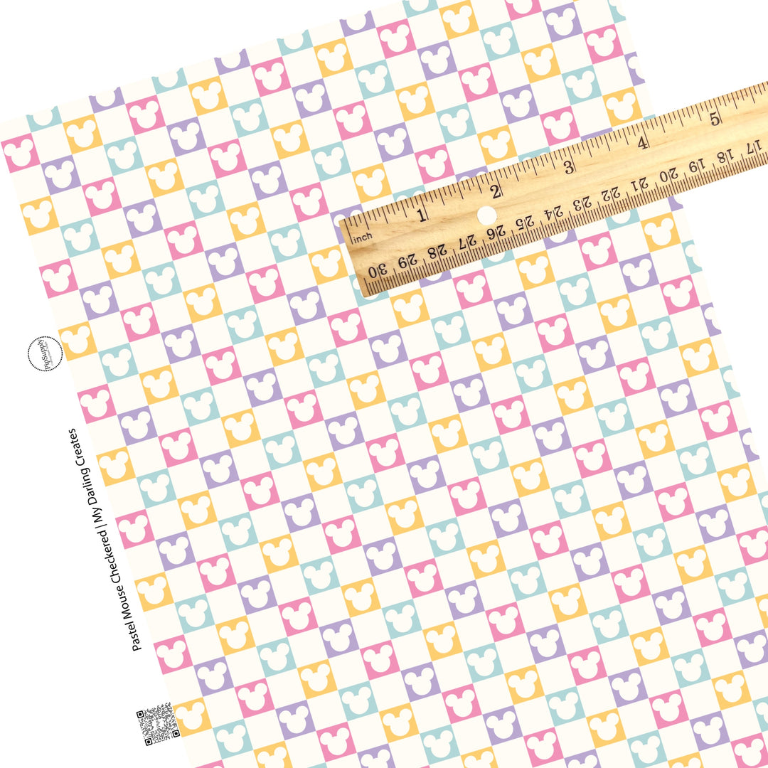 Cream mouse head cutout on pink, purple, yellow, and aqua checkered faux leather sheets