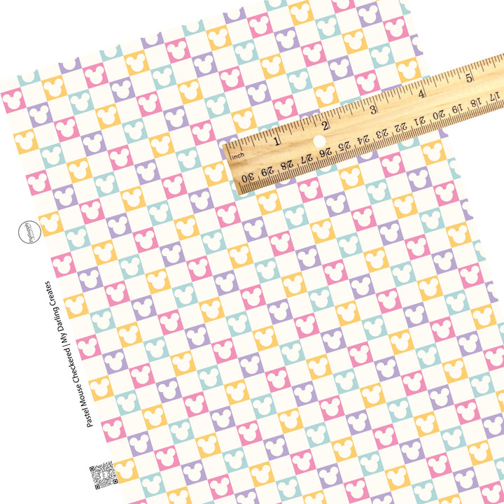 Cream mouse head cutout on pink, purple, yellow, and aqua checkered faux leather sheets