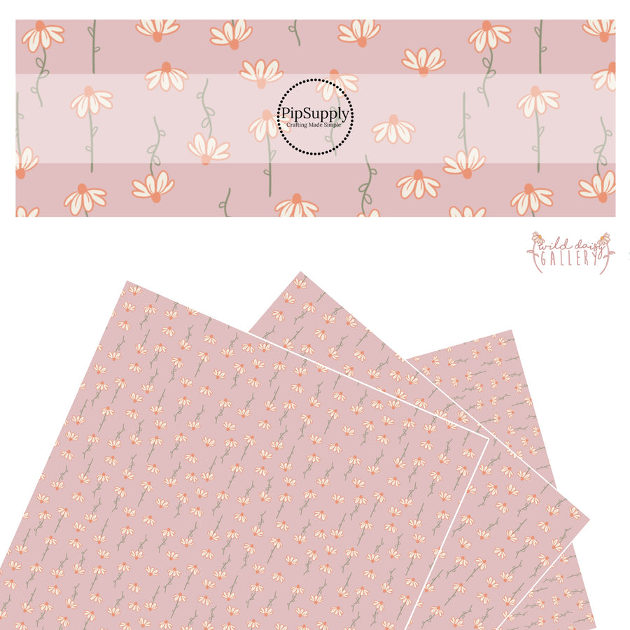 Cream flowers dangling on dusty rose faux leather sheets