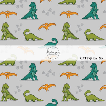 Green, teal, and orange dinosaurs with tracks on gray bow strips