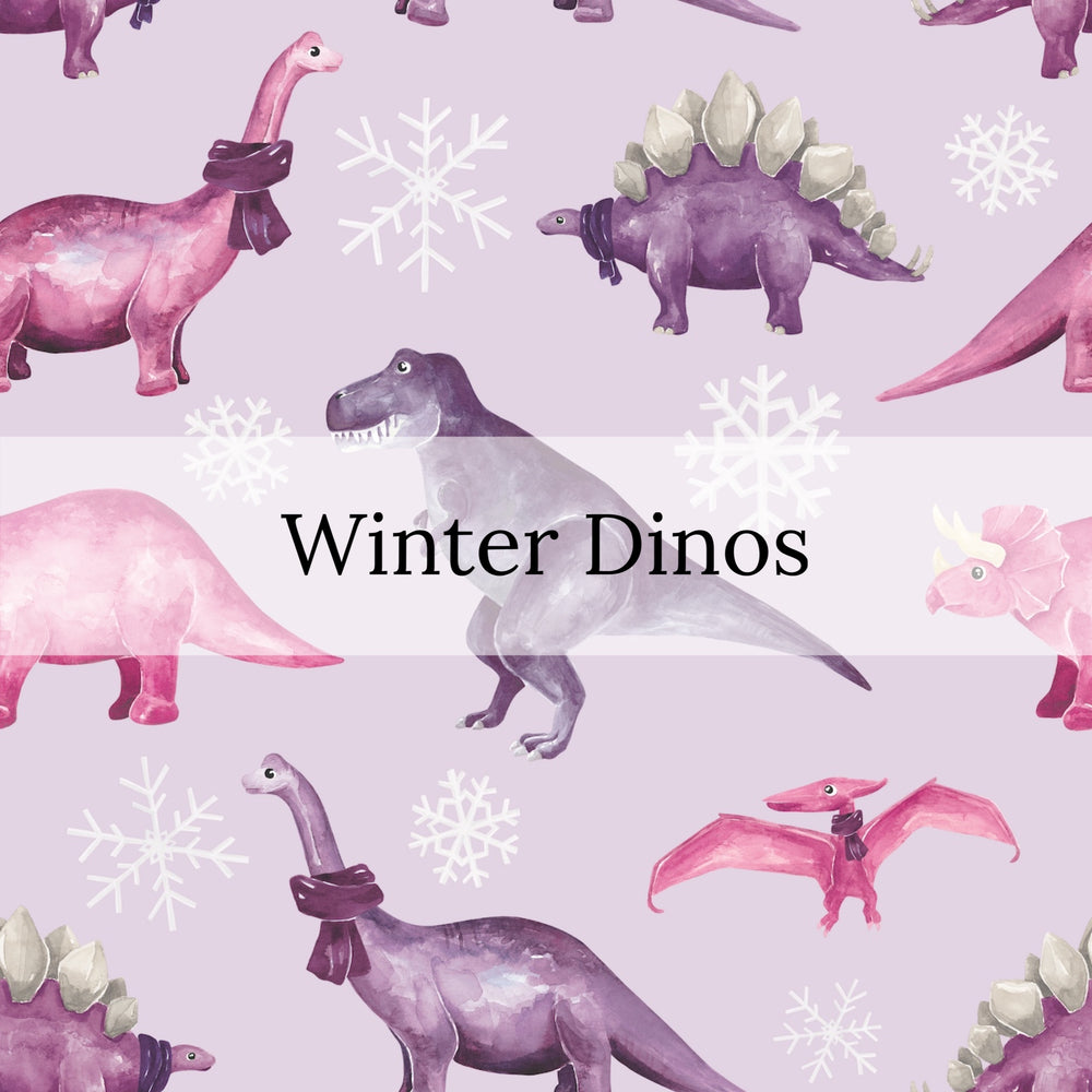 snowflake flurries and pink and purple dinosaurs wearing scarves on light purple bow strips