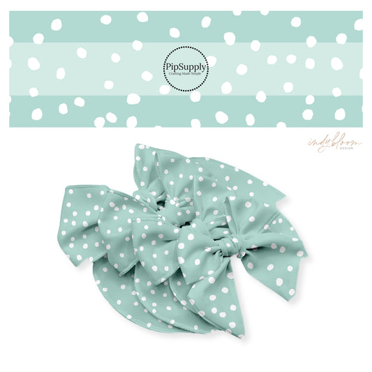 Scattered white dots on mint bow strips