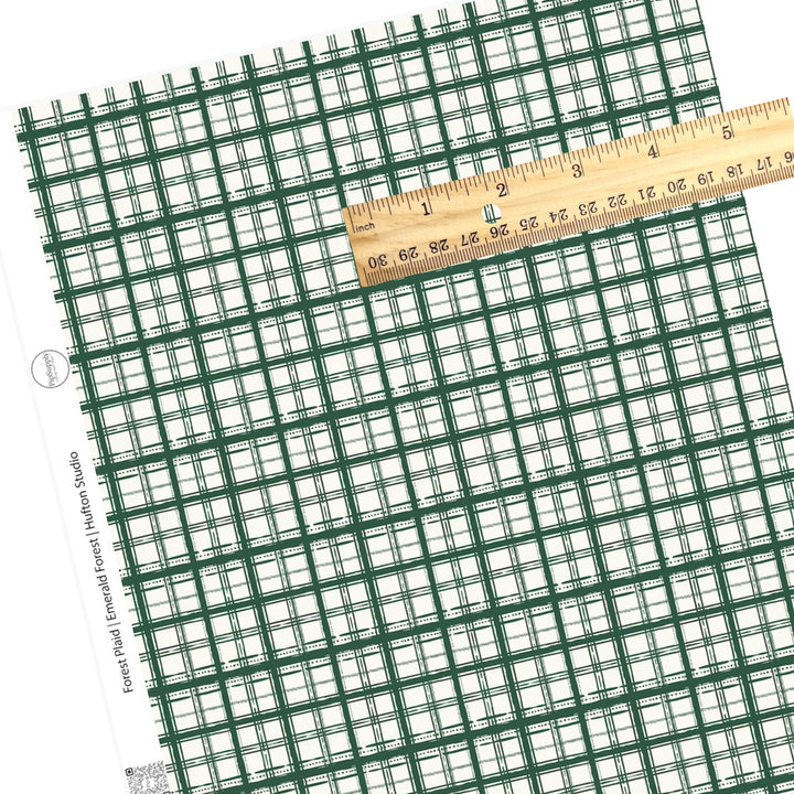 christmas green plaid faux leather sheet on cream background