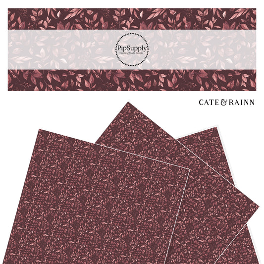 tan leaves on maroon faux leather sheet