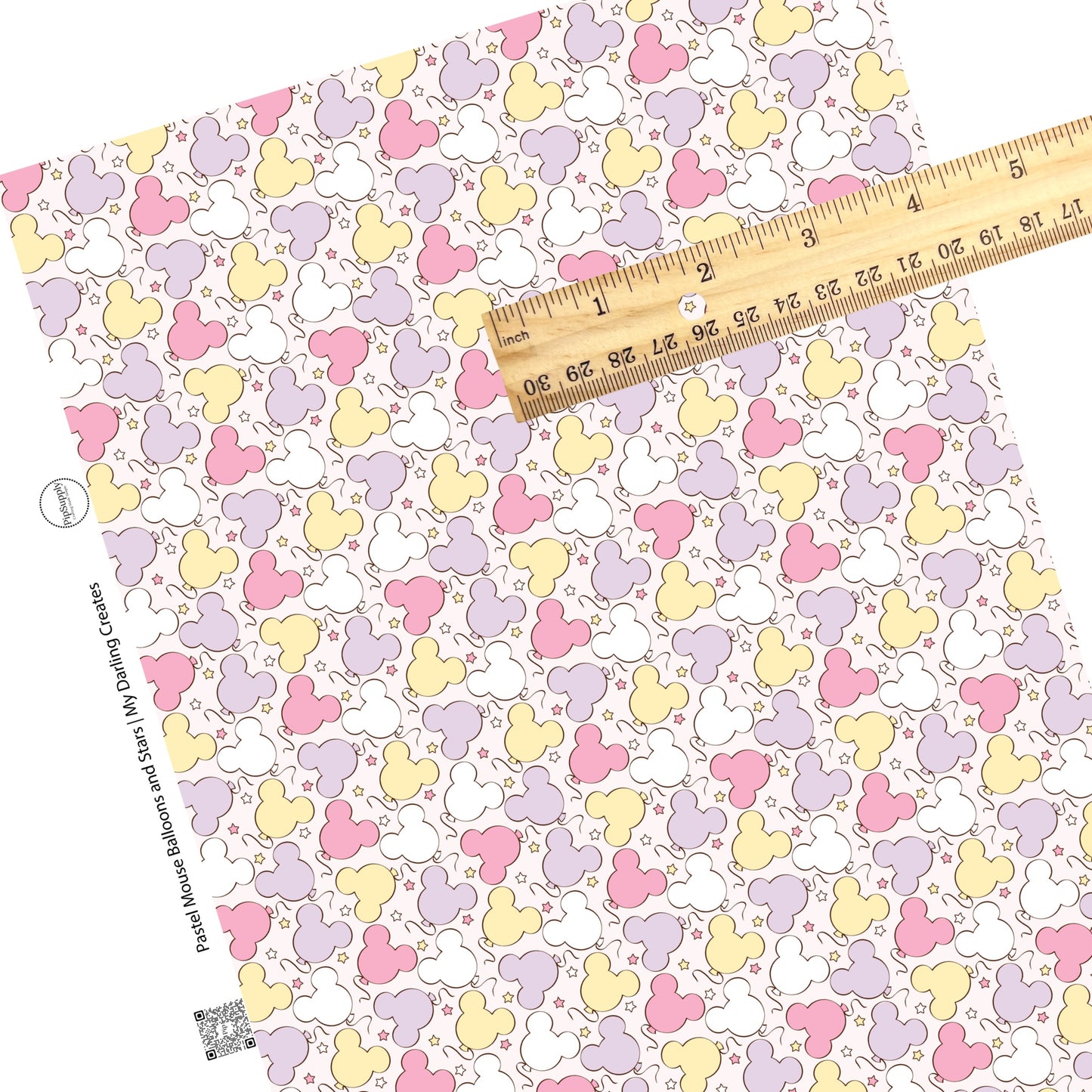 Scattered pastel mouse head balloons and stars on cream faux leather sheets