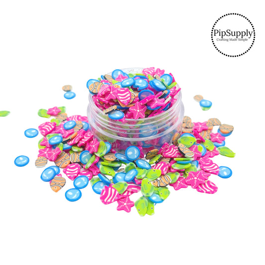 Blue bubbles, pink starfish, and pink orange and green fish clay slices