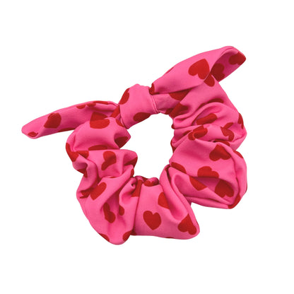 red scattered hearts on bright pink scrunchie