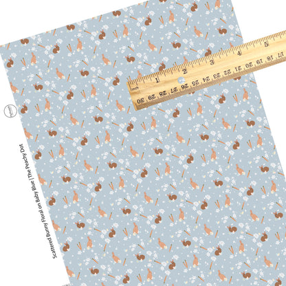 white flowers, brown bunnies, orange carrots, and colorful easter eggs on blue faux leather sheet