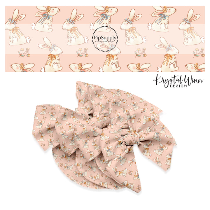 Cream bunnies with floral crown, and flowers on pink bow strips 