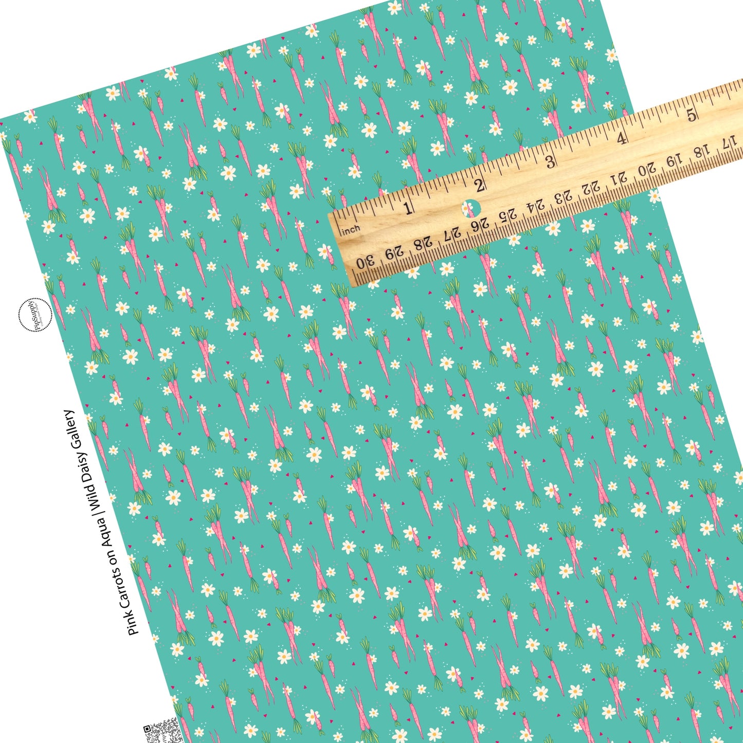 Pink long carrots with tiny cream flowers on aqua faux leather sheets