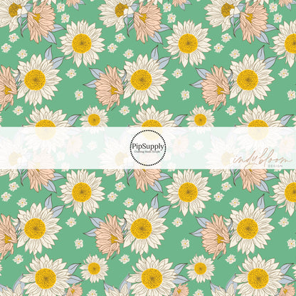 tiny white flowers with big cream and blush sunflowers on green bow strips