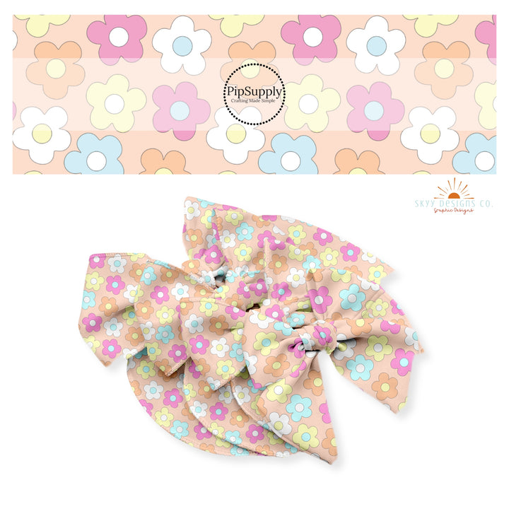 Hot pink, white, orange, yellow, and blue flowers on peach bow strips