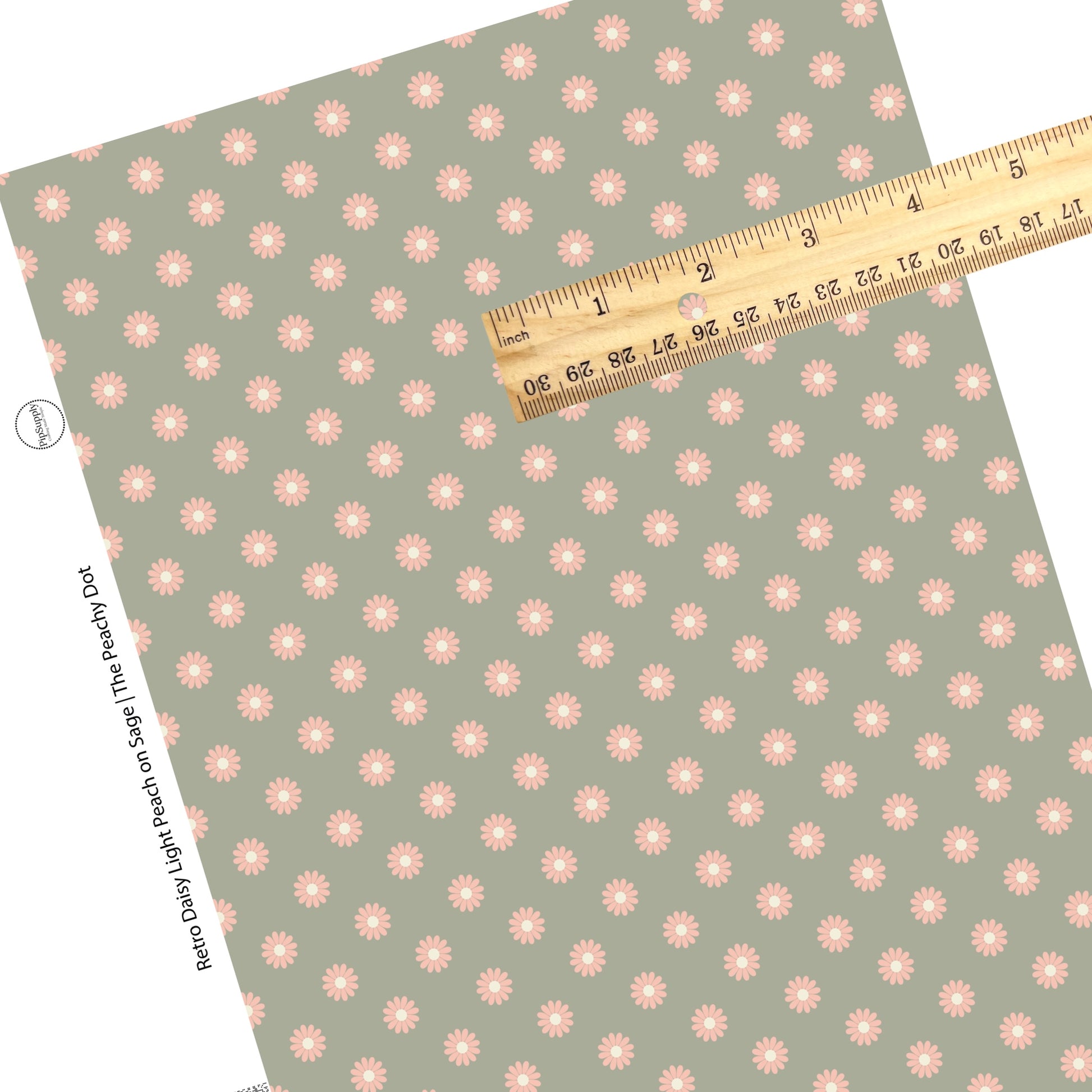 scattered peach flowers on sage faux leather sheets